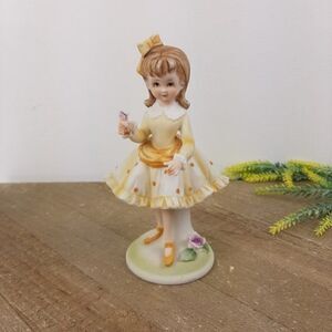 Lefton China Figurine KW 6635 Girl in orange polka dot dress purple flowers 6.5"